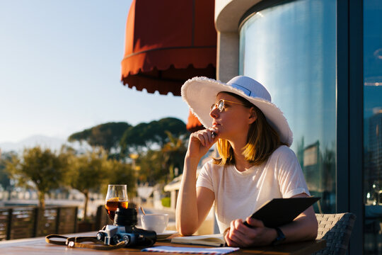 Woman in cafe by the sea