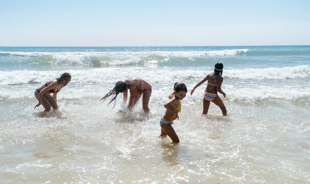 Mother and daughters on the beach