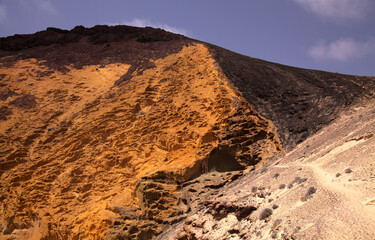Fototapeta premium Spectacular Montana Amarilla, Yellow Mountain, in different colors of volcanic rock on La Graciosa, Canary Islands