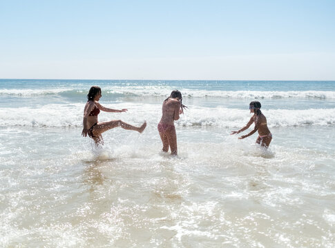 Mother and daughters on the beach