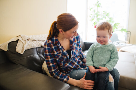 Mom and daughter spending quality time together at home - playin