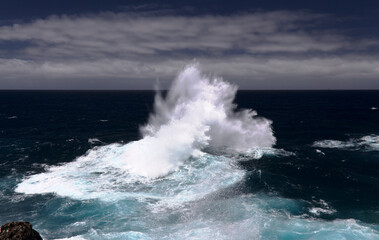 North coast of Gran Canaria, Canary Islands, Banaderos area, strangely shaped wave, resembling underwater explosion, 
formed by a clash of incoming and reflected waves