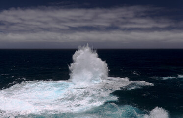 North coast of Gran Canaria, Canary Islands, Banaderos area, strangely shaped wave, resembling underwater explosion, 
formed by a clash of incoming and reflected waves