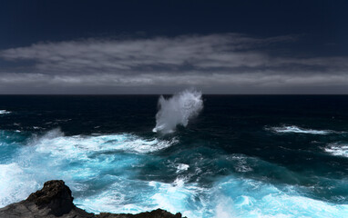 North coast of Gran Canaria, Canary Islands, Banaderos area, strangely shaped wave, resembling underwater explosion, 
formed by a clash of incoming and reflected waves