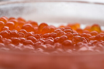 Red caviar in a glass dish

