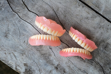 The dentures were left on the old wooden floor.