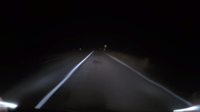 Driving foggy night road, pulling off and stopping