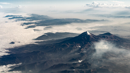 Fototapeta na wymiar Mountain view from an airplane window