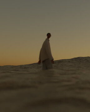 Illustration of man standing in sea against sky