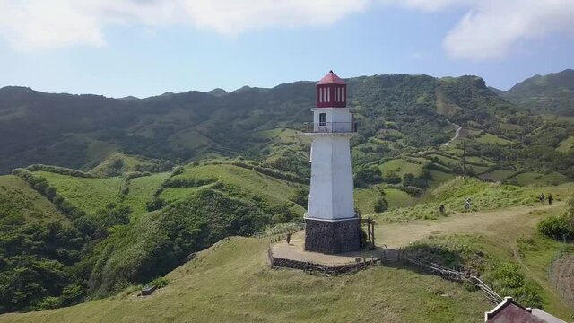 Aerial of Batanes Lighthouse on hills philippines