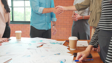 Close up hands of office people discuss and brainstorm over paperwork