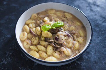 plant-based food, vegan mushroom gnocchi with dairy-free mushroom sauce ance basil