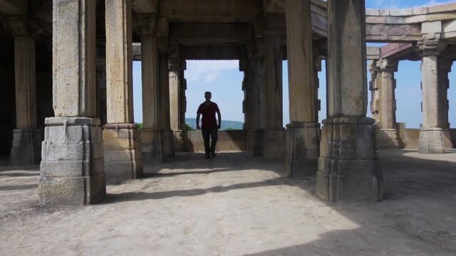 Young guy exploring world heritage Kabutar khana Pavilion also known as khajuri mosque