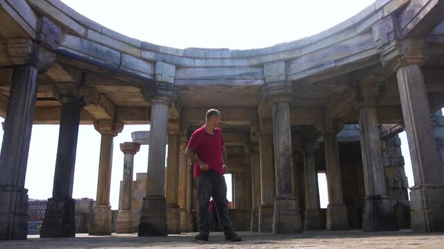 Young guy exploring world heritage Kabutar khana Pavilion also known as khajuri mosque