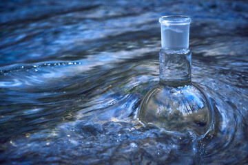 Glass flask with clear water.