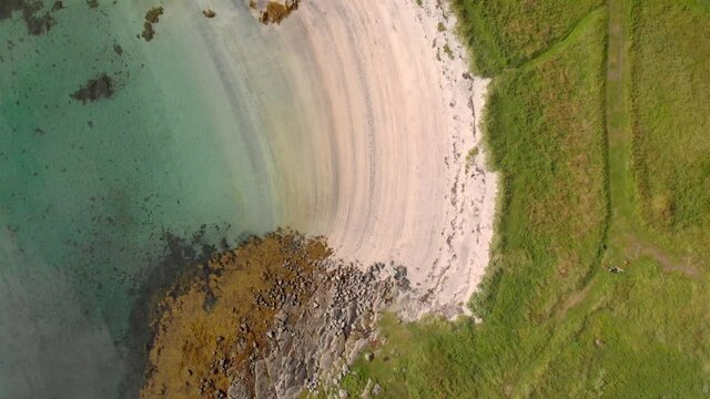 Top down aerial view fly by of idyllic sand beach at helgeland in Northern Norway
