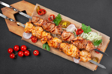 Hot grilled chicken shish kebab, with cherry tomatoes,
