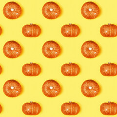 Creative seamless pattern with small round pumpkin. Autumnal holiday concept, fall, harvest, thanksgiving, halloween.