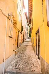 Fototapeta na wymiar Old Narrow Cobblestone Street in Bellagio. Italy.