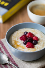 Bowl of Porridge with Coffee and Cookbook