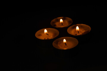 Many small candles in the dark religion