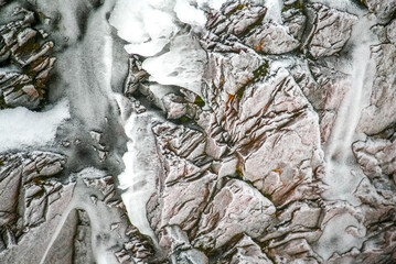 Gray rock in snow