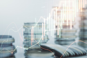 Abstract virtual financial graph hologram on stacks of coins background, forex and investment concept. Multiexposure