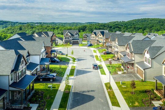 Aerial view of newly built high end property, luxury single family alp style house community at Lake Linganore Oakdale leading to a cul-de-sac neighborhood street in Maryland USA