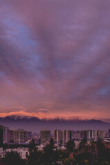 Obraz premium Scenic view of beautiful clouds and sunset sky over Santiago and The Andes Mountains, Chile 