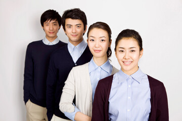 young men and women in a row looking at camera