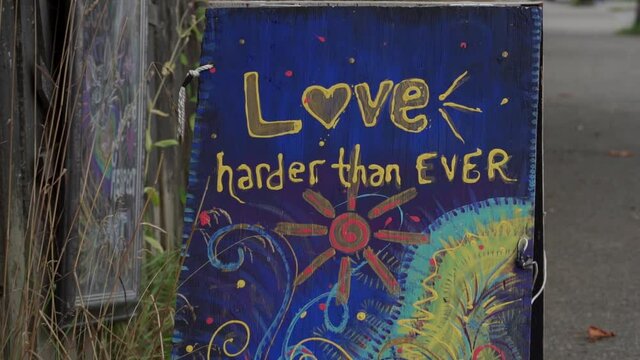 Sign depicting the message of love downtown BC.