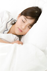 Fototapeta premium sleeping young woman on a bed