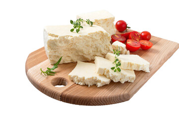 Tasty healthy sheep or goat feta cheese. Chunks of cheese on a wooden board isolated on white.