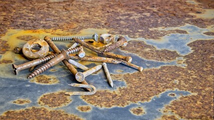 Small Pile of Rusty Nails Nuts and Bolts
