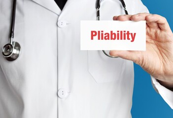 Pliability. Doctor holds a business card in his hand. Text is on the sign. Close up.