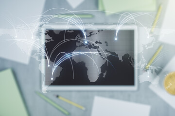 Double exposure of abstract digital world map with connections and digital tablet on background, top view, research and strategy concept