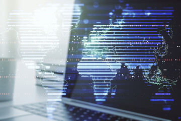 Multi exposure of abstract creative digital world map on modern laptop background, tourism and traveling concept concept