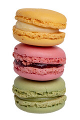 Pastries, desserts and sweets. Close-up of a yellow french lemon macaroon, a red raspberry macaron and a green pistachio macaroon isolated on a white background. Macro photograph.