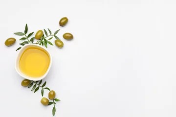 Gordijnen Bowl of olive oil on white background © Pixel-Shot