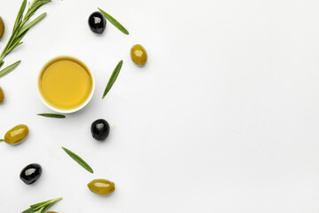 Composition with bowl of olive oil on white background