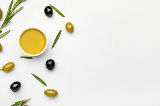 Composition With Bowl Of Olive Oil On White Background