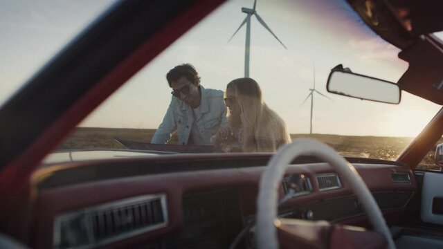 Video of couple indicating the destination of the trip. Shot with RED helium camera in 8K.