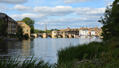 The River Ouse at St Ives  Cambridgeshire with the historic bridge and river port.