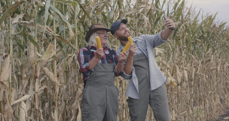 Farmers taking selfie with corn