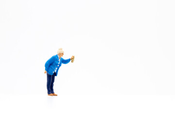 Miniature people standing on white background and copy space for your text 