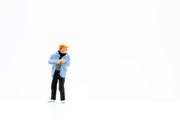 Miniature people standing on white background and copy space for your text 