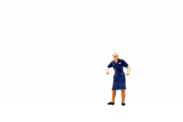 Miniature people standing on white background and copy space for your text 