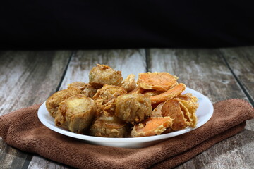 Traditional deep fried crab meat roll and spring roll on the plate. Famous crispy and crunchy menu in Chinese dim sum. 
