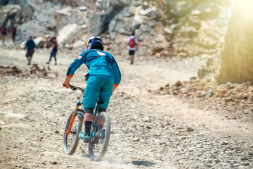 Naklejka premium Biking on the Mountain Trail in summer season