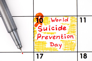 Reminder World Suicide Prevention Day in calendar with pen